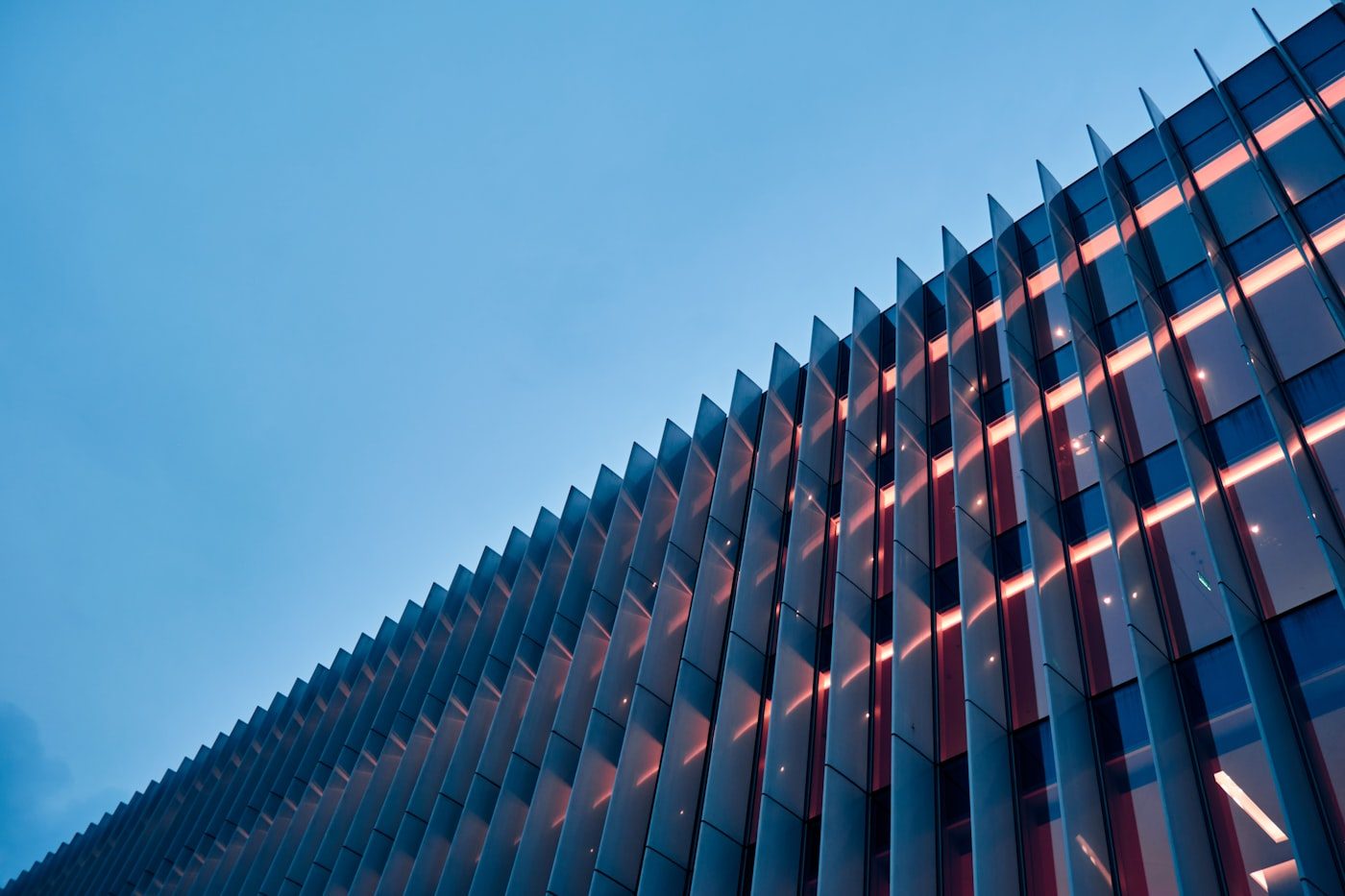 A tall building facade with a grid of windows