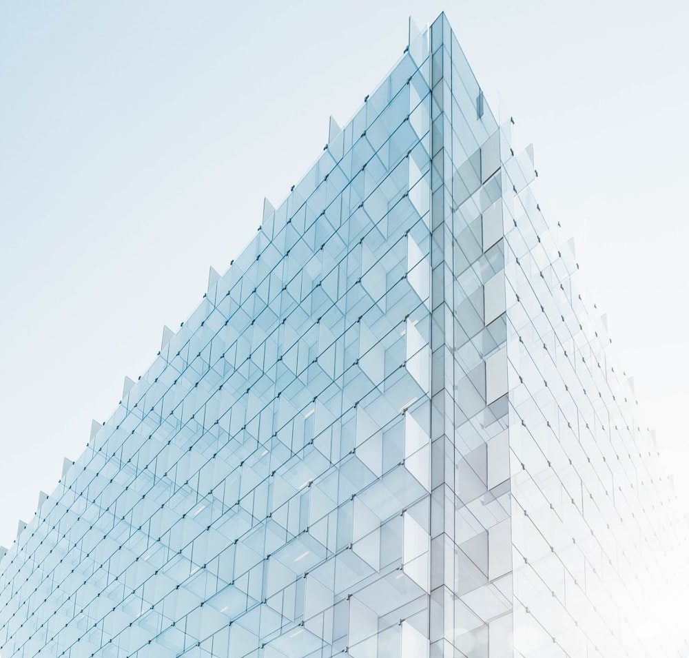 Angled view of a modern glass office building facade